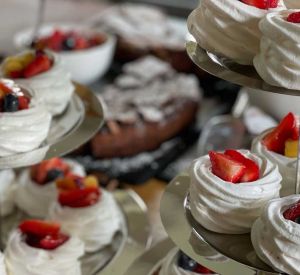 A selection of meringues with fruit on the top