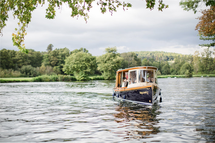 Arrive in style to your island hide-away. Stylish boat in Henley bringing private guests to enjoy Temple Island, Henley